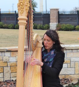 Haley Hodson playing the harp.